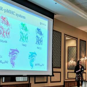 Photo of Angie presenting, 2019