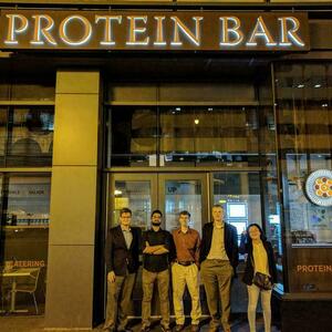 Lab members under Protein Bar sign in 2017