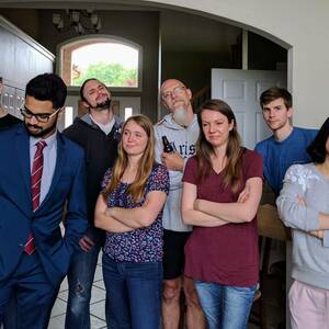 Eight lab members stand together for photo in 2017